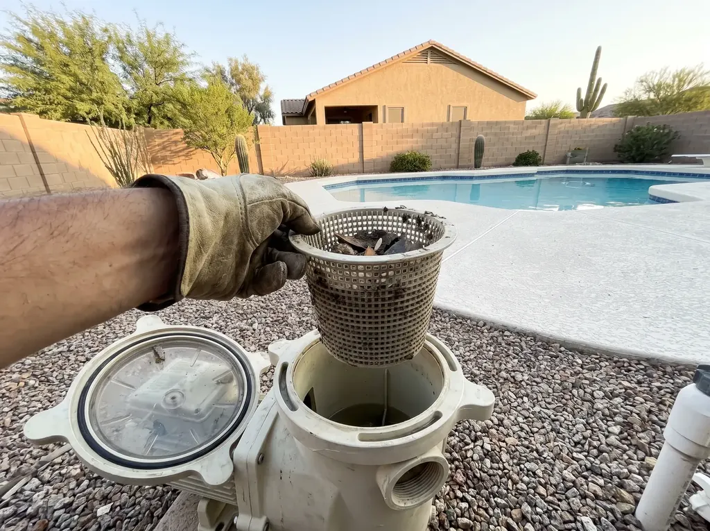 Pool pump with its lid open during a repair
